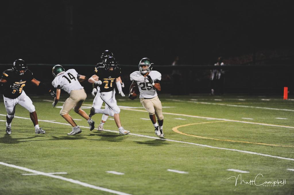 Zach Roper rolls up field on a kickoff return. Photo courtesy of Matt Campbell Photography