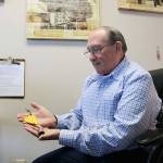 Stephanie Quiroz/staff photo                                Paul Brown looks at his Be Kind bell he received following the Marysville Pilchuck High School shooting.