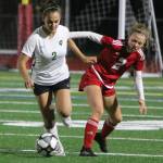 Redmonds Talia Cohen, left, battles for the ball with Newports Carmen Young on Oct. 15. Andy Nystrom/ staff photo