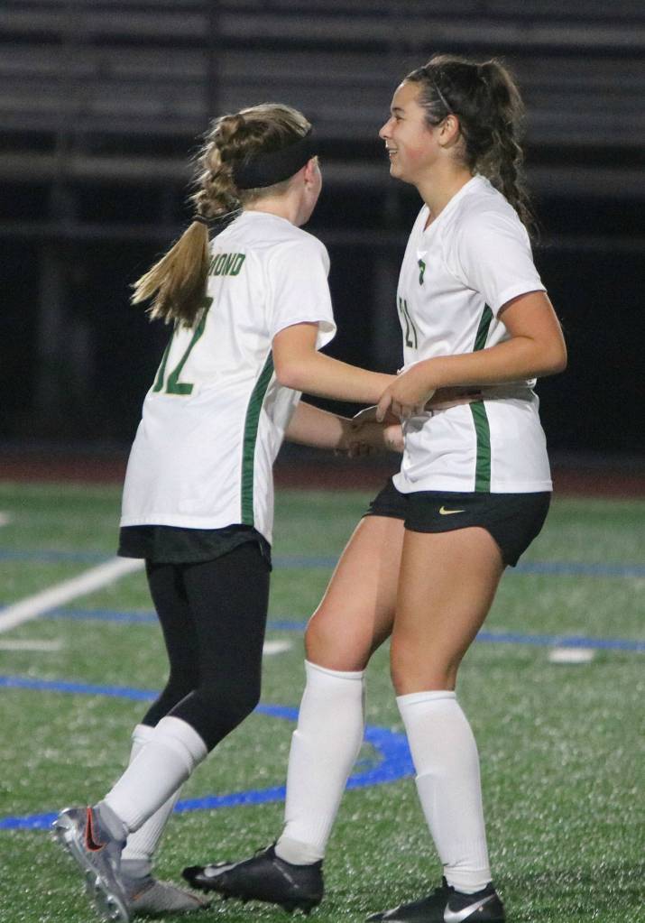 Redmonds Halle Howe, left, and Izzy Bach-Lefler celebrate a goal. Andy Nystrom/ staff photo