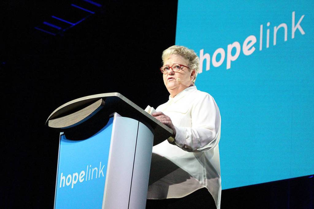 Cathy Powers shares her story of her and her familys life-changing experience through Hopelink at the 24th annual Reaching Out luncheon. Madison Miller/staff photo