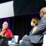 Madison Miller/staff photo                                 Queen Latifah discusses how poverty should be talked about more at the 24th annual Reaching Out luncheon with co-chairs Lynne Varner and Paul Hollie.