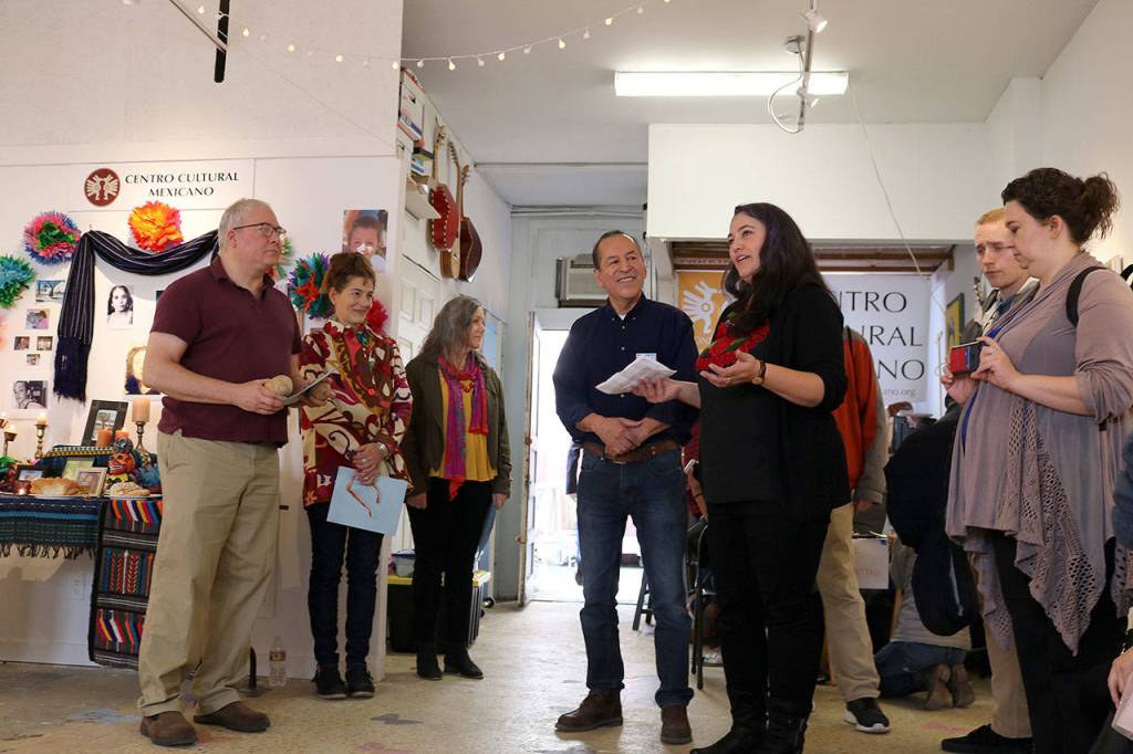 Executive director Carlos Jimenez and director Angie Hinojos Yusuf welcome the community to the Día de los Muertos event at the Centro Cultural Mexicano in Redmond on Nov. 2. Stephanie Quiroz/staff photo