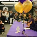 An overflowing crowd watches Jennifer Cummings and Adithi Anand commit to the University of Washington. Andy Nystrom/ staff photo