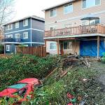 The vehicle crashed into the home and rolled backwards into the ravine. Photo courtesy of Redmond Police Department