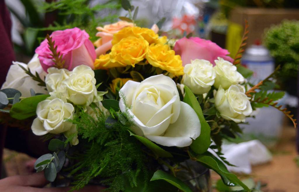 Lisa Aliment does not believe the beauty and art of high-end flower arrangements has faded; people still prefer professionally designed flowers over mass-produced grocery store selections or a bucket shop where flowers are hastily grouped and bundled. Samira George/staff photo