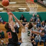 Redmonds Nathan Miller (2) blocks Monroes James Storhow (20) in nonleague action on Dec. 4. Photo courtesy of Dale Garvey