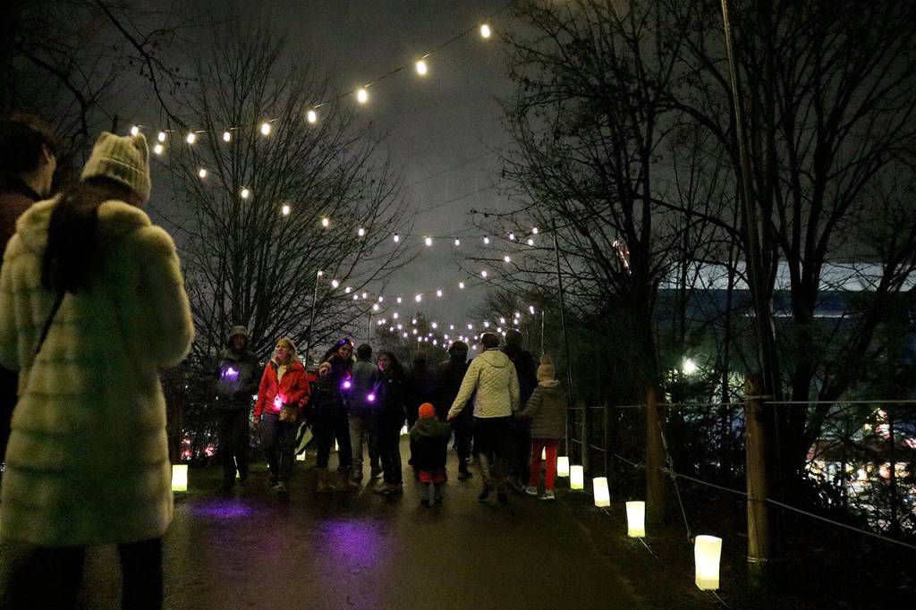 Crowds walked the enchanting luminary walk to Redmond Town Center, along the Redmond Central Connector trail. Stephanie Quiroz/staff photo