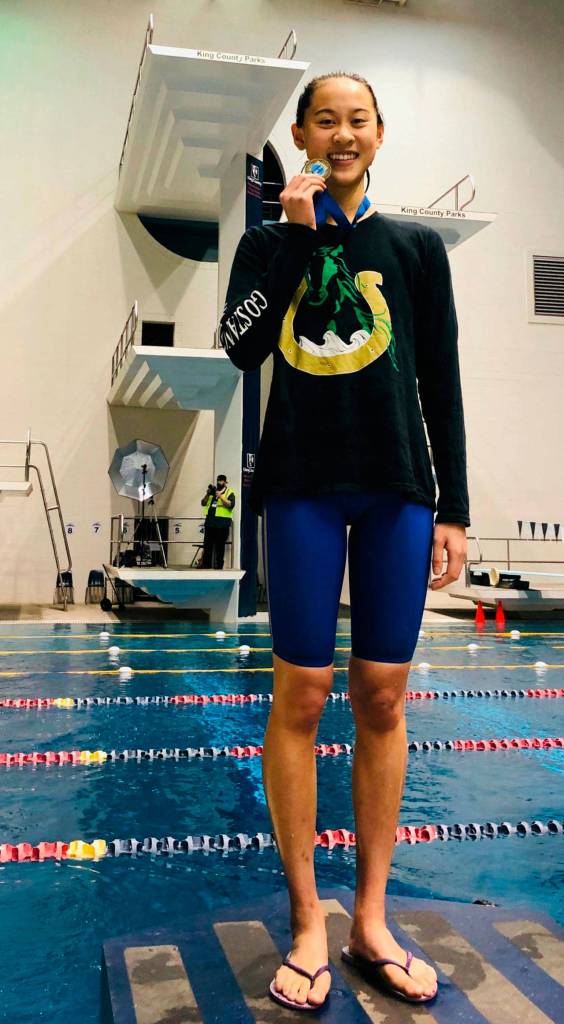 Redmonds Catherine Yu after receiving her 4A state first-place championship medal for the 100-yard breaststroke. Courtesy photo