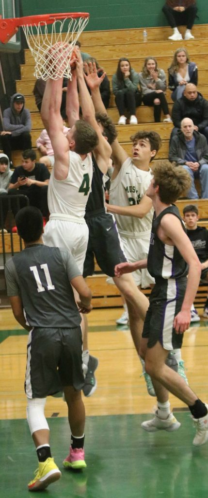 Redmond and North Creek players battle for the ball. Andy Nystrom/ staff photo