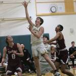 Overlake freshman Jake Shuey drives to the hoop against Northwest. Andy Nystrom/ staff photo