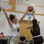 Overlake senior Eliza Friend, left, backhands a block against Northwests Shoshana Rosen on Tuesday night. Andy Nystrom/ staff photo