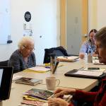 Jake Berg/staff photo                                 Bula Daw reads aloud during the creative writing group offered by the Redmond senior center. Due to the closure of the senior center, the creative writing group has been meeting in City Hall on Tuesdays.