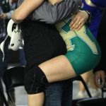 Molly Williams joyfully hugs one of her Redmond High coaches after securing a 12-1 championship win. Andy Nystrom/ staff photo