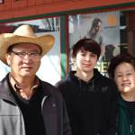 (L-R) Joe Hong, Marcus Chhong and Sally Hong pose outside of Redmond Work and Western Wear in Redmond on March 4. Mitchell Atencio/staff photo