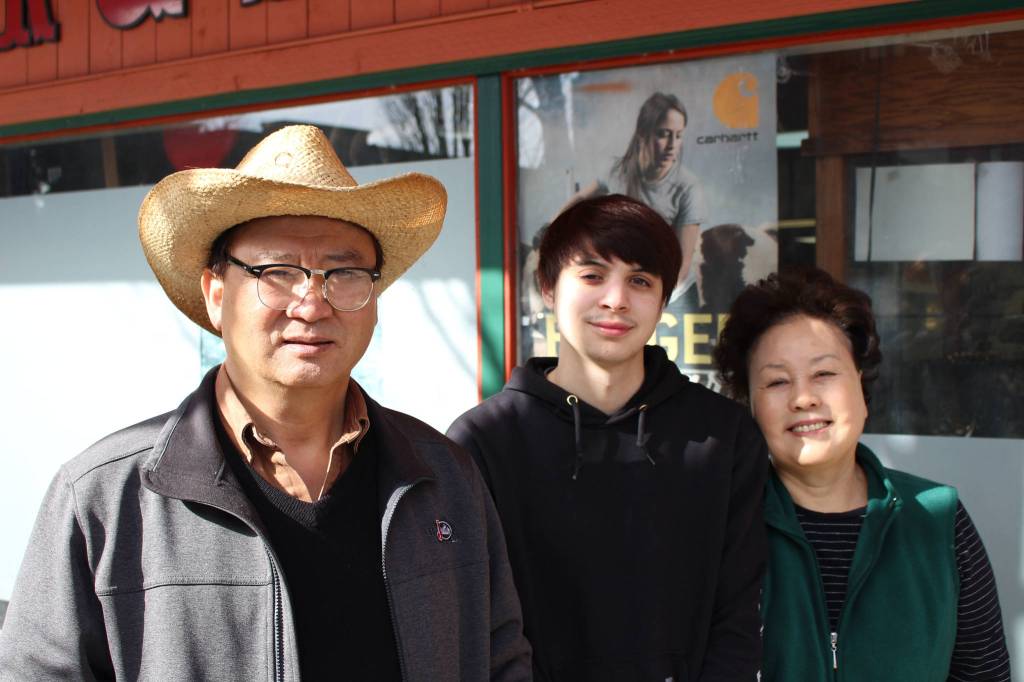(L-R) Joe Hong, Marcus Chhong and Sally Hong pose outside of Redmond Work and Western Wear in Redmond on March 4. Mitchell Atencio/staff photo