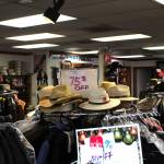 The floor of Redmond Work and Western Wear displaying sale signs in Redmond on March 4. Mitchell Atencio/staff photo