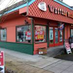 Open signs and sale signs mark the windows of Redmond Work and Western Wear in Redmond on March 4. Mitchell Atencio/staff photo