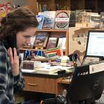 Margaret Hansen works at the counter at Brick & Mortar Books in Redmond Town Center. Photo courtesy of Brick & Mortar Books