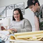 Angie Adam has been using materials given to her from her great grandmother to sew masks for health care workers. Ray Miller-Still/staff photo