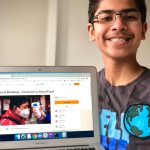 Redmond Middle School student Om Shah holds up a laptop showing the GoFundMe page he created to support low-income families during the coronavirus pandemic. Courtesy photo