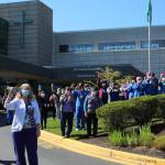 St. Francis staff cheer and wave as the final vehicle in the parade drove away. Olivia Sullivan/staff photo
