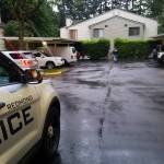 Detectives at the apartment where a 59-year-old Redmond resident was found dead, after an autopsy revealed a gunshot wound to the head, Saturday, May 16. Photo courtesy of Redmond Police Department.