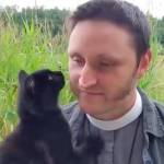 Screenshot of the stray kitten and the Rev. Aaron Burt from the July 12 liturgy video.
