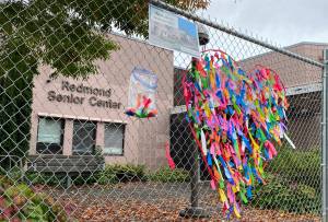 The closed Redmond Senior Center on Oct. 13. Community members leave ribbons in the heart to honor the memories of the to-be-demolished center. Haley Ausbun/staff photo.