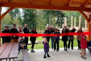 Redmond Mayor Angela Birney (center) cuts the ceremonial ribbon (courtesy of City of Redmond)