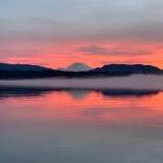 Photo courtesy of Abbie Crane, who writes that on Jan. 12, 2022, "I walked on the East Lake Sammamish Trail at about 4:30 p.m. The combination of a colorful, beautiful sunset and a bank of fog on the lake made these pictures very special. Mt. Rainier made an appearance."