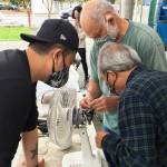 Photo courtesy of King County Solid Waste Division
Volunteer fixers attempt to repair a fan at one of King Countys 2021 repair events.
