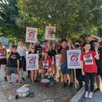 Employees of the Homegrown Redmond location stand together in solidarity on August 25. Hannah Saunders / Sound Publishing