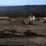 Solid Waste Division workers bring waste to Cell 8 of the landfill, working to flatten out the countys garbage. Photo by Bailey Jo Josie/Sound Publishing.