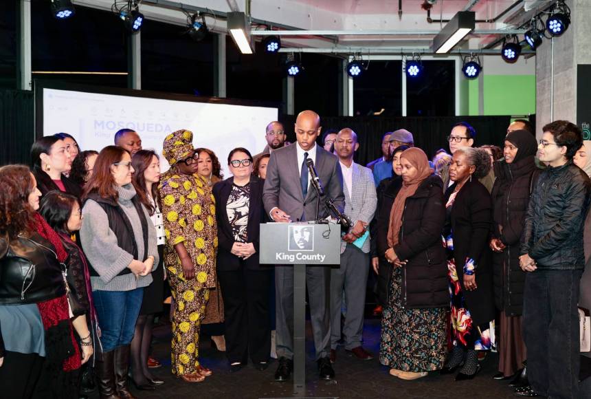 <p>King County Executive Girmay Zahilay, surrounded by community members, announces an executive order to protect immigrants at a press conference Feb. 12, 2026. Photo courtesy of King County Office of the Executive</p>