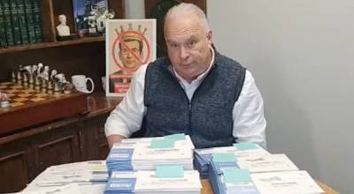 A screenshot from the video Washington State Republican Party Chair Jim Walsh posted with ballots he says were handed off to him by a concerned citizen who found them next to a dumpster in Renton. (Video screenshot via Facebook)